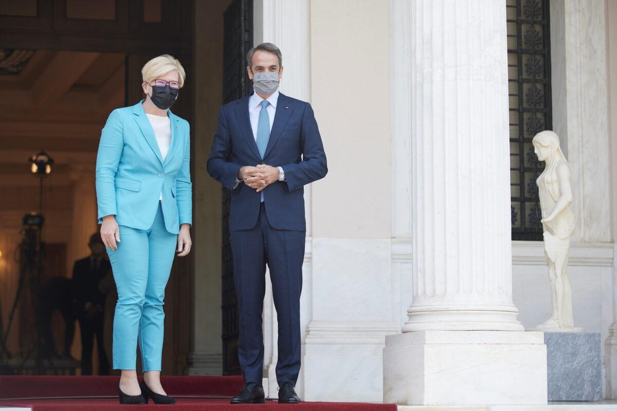 Greek Prime Minister Kyriakos Mitsotakis welcomes his Lithuanian counterpart, Ingrida Simonyte, at the Maximos Mansion in Athens, on July 15, 2021. (Dimitris Papamitsos/Greek Prime Minister's Office/Handout via Reuters)