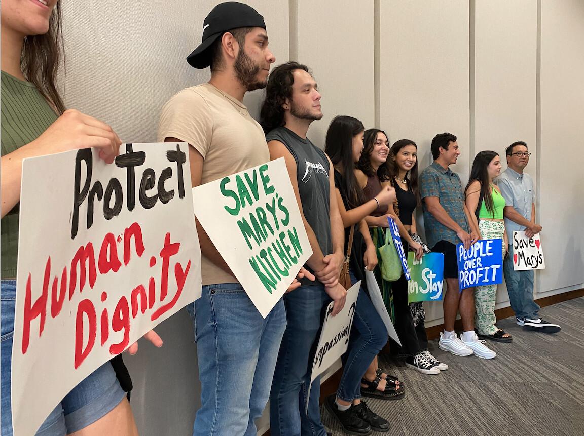 Community members protest the city of Orange's decision to shut down Mary's Kitchen, a soup kitchen for the homeless, in Orange, Calif., on July 13, 2021. (Chris Karr/The Epoch Times)