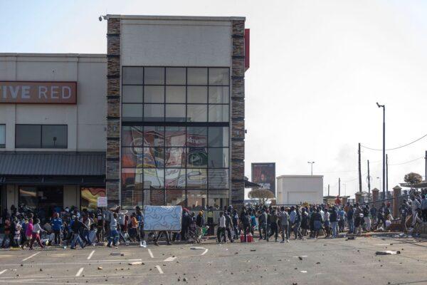 Rioters loot the Jabulani Mall in Soweto, southwest of Johannesburg, on July 12, 2021.(Guillem Sartorio/AFP via Getty Images)