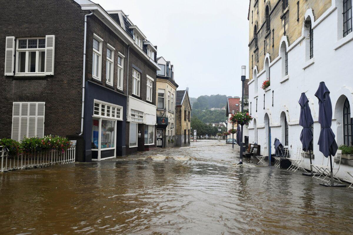 A flooded street is seen following heavy rainfalls in Valkenburg, Netherlands, on July 15, 2021. (Piroschka Van De Wouw/Reuters)