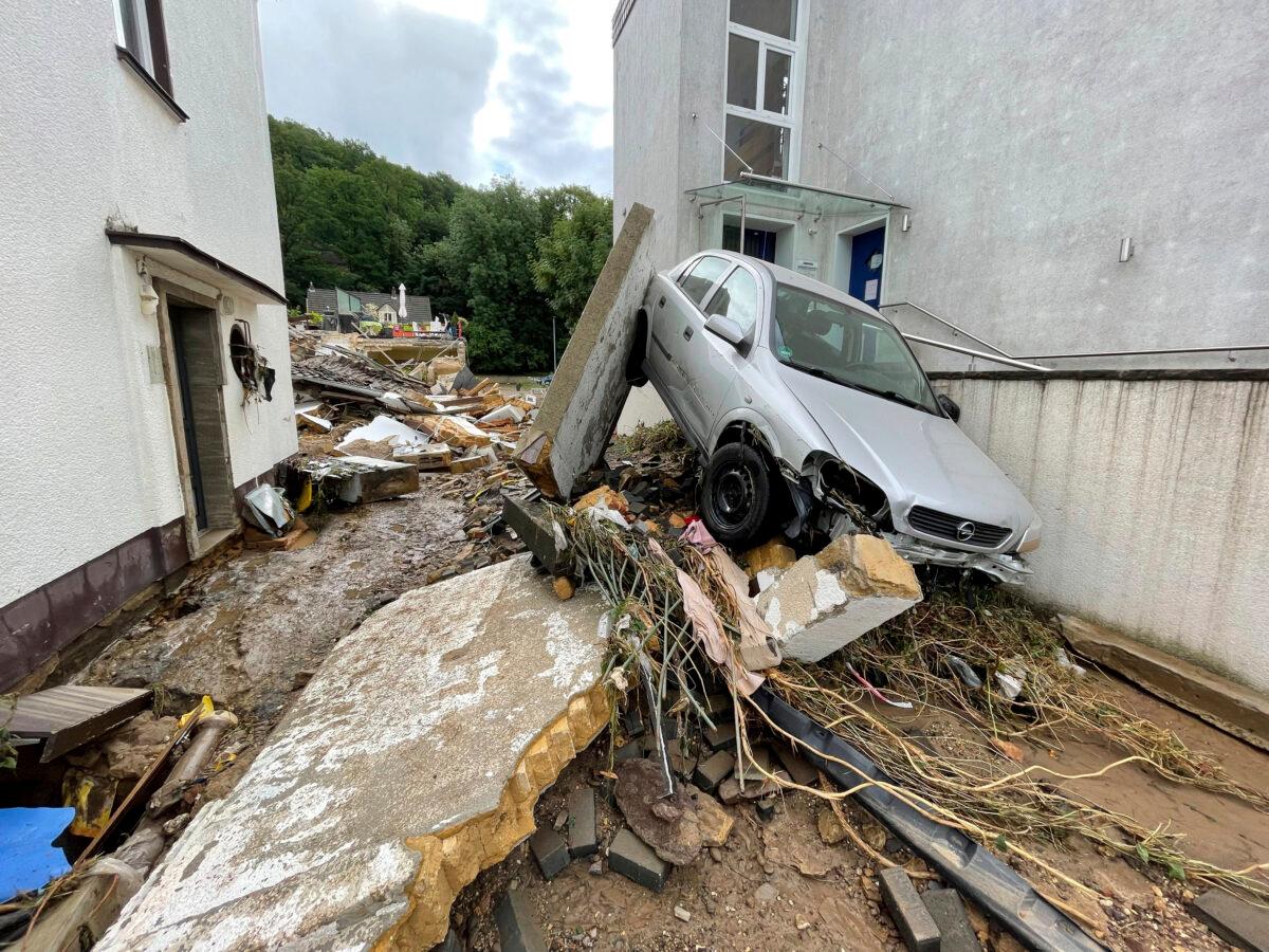 A street is covered with debris after heavy rainfall and the flooding of the Erft river in Germany, on July 15, 2021. (B&S/dpa via AP)