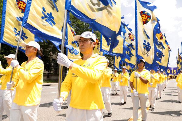 Falun Gong practitioners take part in a parade marking the 22nd anniversary of the start of the Chinese regime's persecution of Falun Gong, in Washington on July 16, 2021. (Samira Bouaou/The Epoch Times)