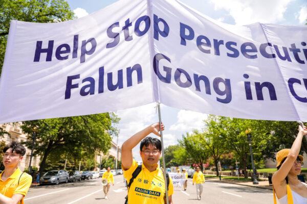 Falun Gong practitioners take part in a parade marking the 22nd anniversary of the start of the Chinese regime's persecution of Falun Gong, in Washington on July 16, 2021. (Samira Bouaou/The Epoch Times)