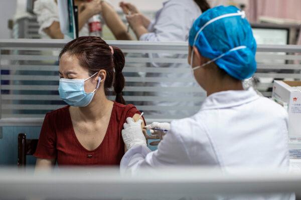 A medical worker administers the COVID-19 vaccine to a resident at a community health service location in Wuhan, China on June 21, 2021. (Getty Images)