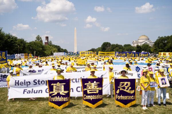 Falun Gong practitioners take part in a parade marking the 22nd anniversary of the start of the Chinese regime's persecution of Falun Gong, in Washington on July 16, 2021. (Larry Dye/The Epoch Times)