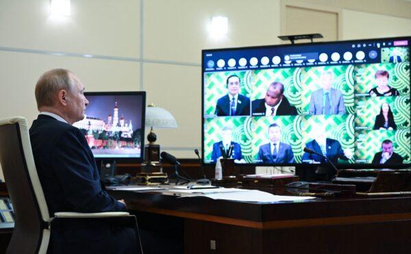 Russian President Vladimir Putin attends a meeting of the Asia-Pacific Economic Cooperation (APEC) chaired by New Zealand, via video link at Novo-Ogaryovo state residence, outside Moscow, on July 16, 2021. (Alexey Nikolsky/Sputnik/AFP via Getty Images)
