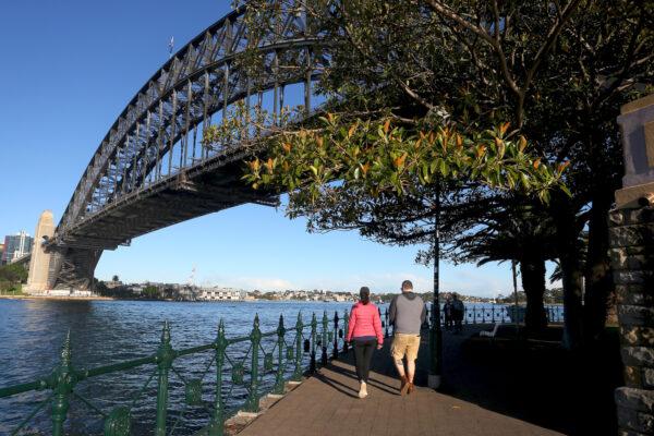 People are seen exercising along the Milsons Point boardwalk in Sydney, Australia on July 16, 2021. (Lisa Maree Williams/Getty Images)