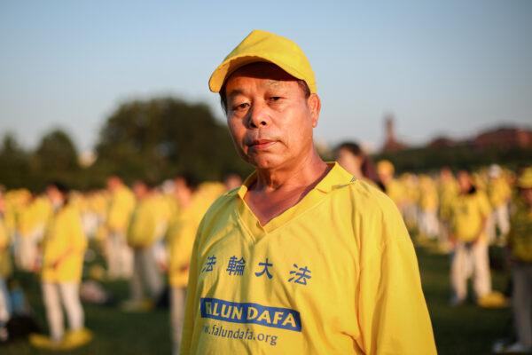 Liu Xitong, a calligrapher, takes part in an event marking the 22nd anniversary of the start of the Chinese regime’s persecution of Falun Gong, in Washington on July 16, 2021. (Samira Bouaou/The Epoch Times)