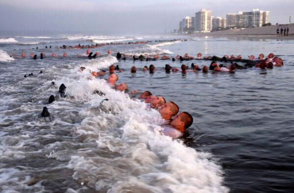 Navy SEAL candidates participate in "surf immersion" during training in Coronado, Calif., on May 4, 2020. (MC1 Anthony Walker/U.S. Navy via AP)