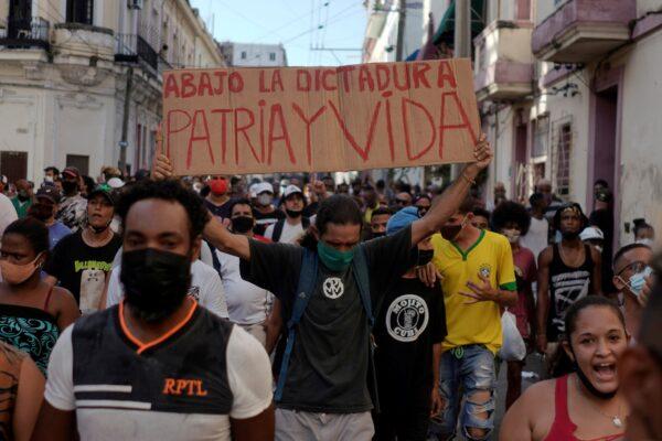 People shout slogans against the communist regime during a protest in Havana, Cuba, on July 11, 2021. (Alexandre Meneghini/Reuters)