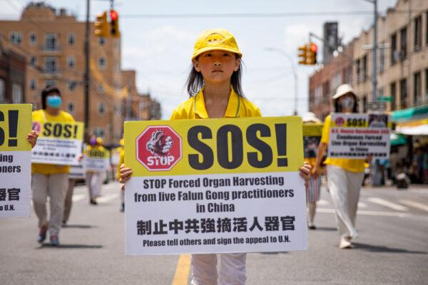 Falun Gong practitioners take part in a Brooklyn parade marking the 22nd year of the persecution of Falun Gong in China on July 18, 2021. (Chung I Ho/The Epoch Times)