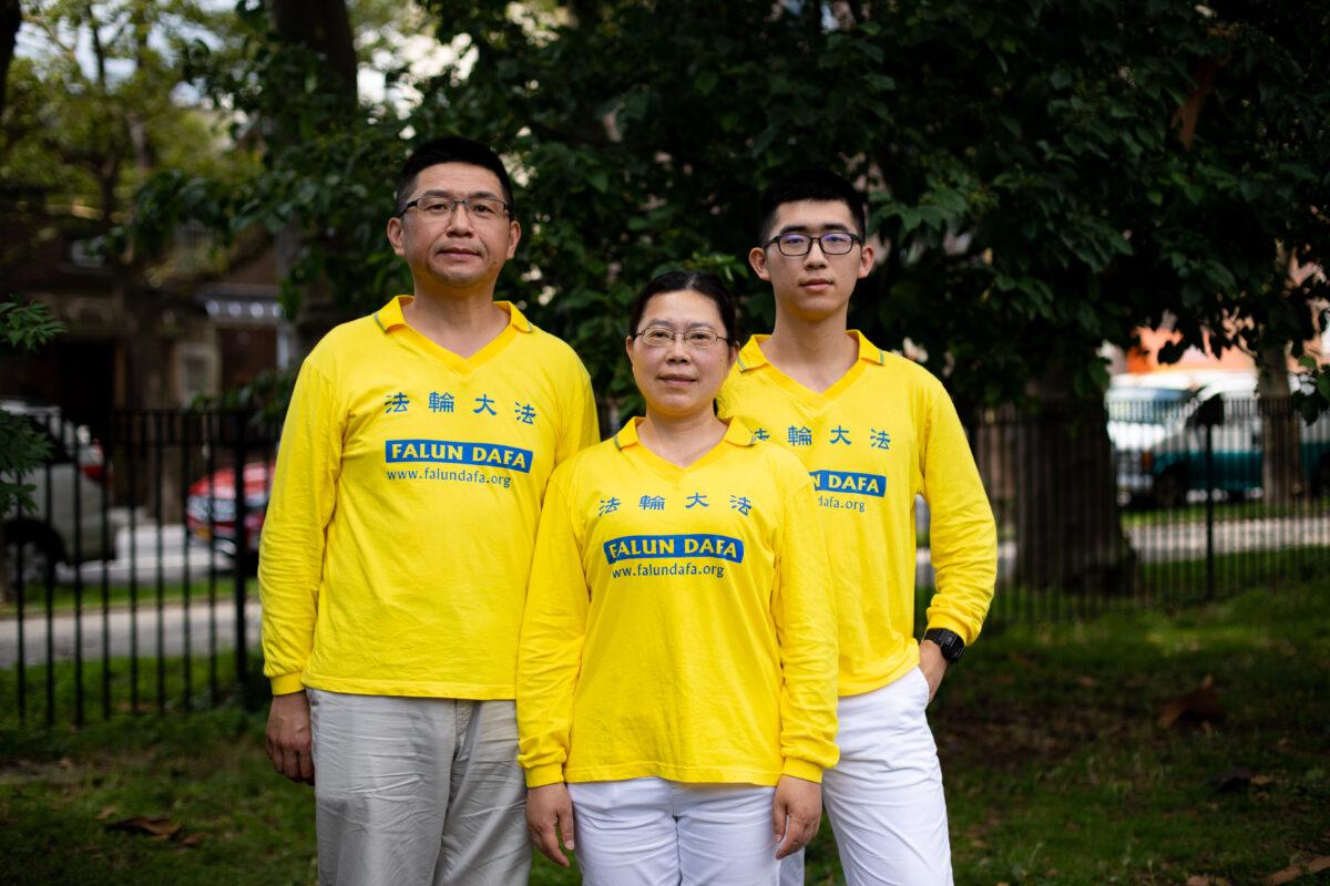 Peng Zhaoli (C), with her husband and her son, ahead of a parade marking the 22nd year of the persecution of Falun Gong in China, in Brooklyn, N.Y., on July 18, 2021. (Chung I Ho/The Epoch Times)