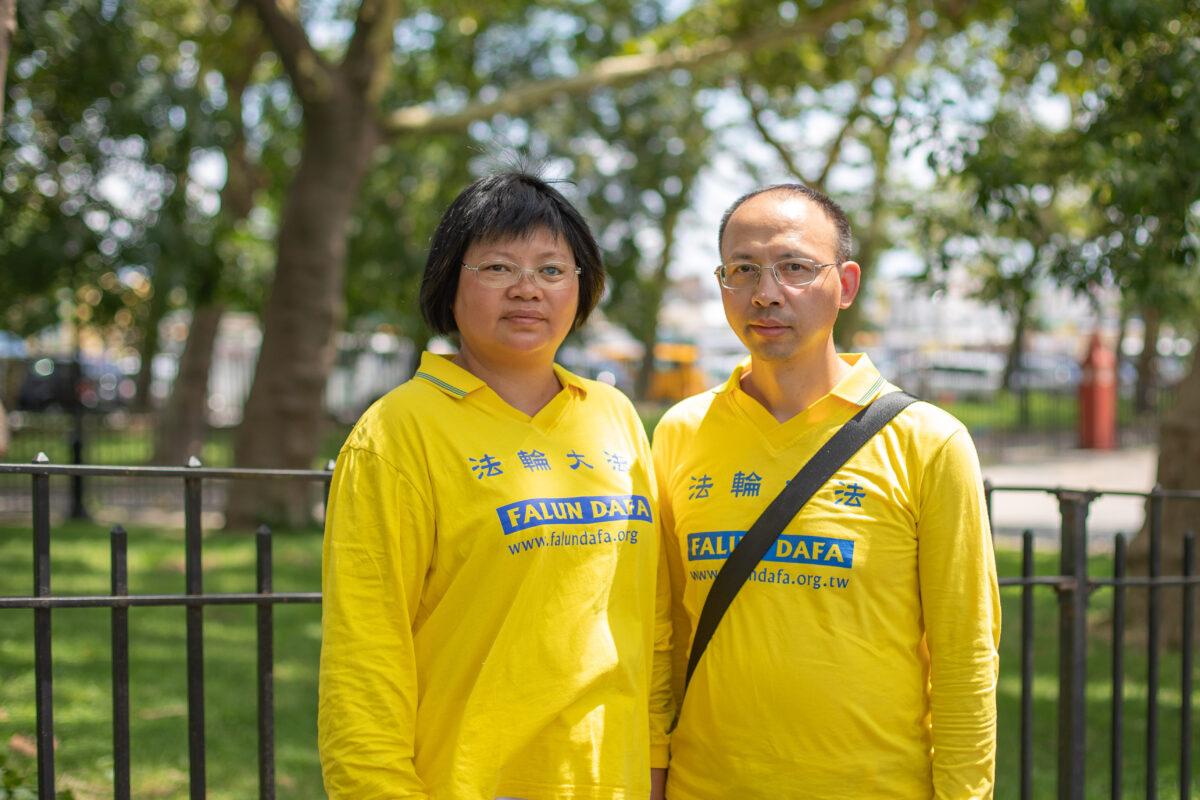 Xia Haizhen and her husband, Luo Jiaolong, take part in a parade marking the 22nd year of the persecution of Falun Gong in China, in Brooklyn, N.Y., on July 18, 2021. (Chung I Ho/The Epoch Times)