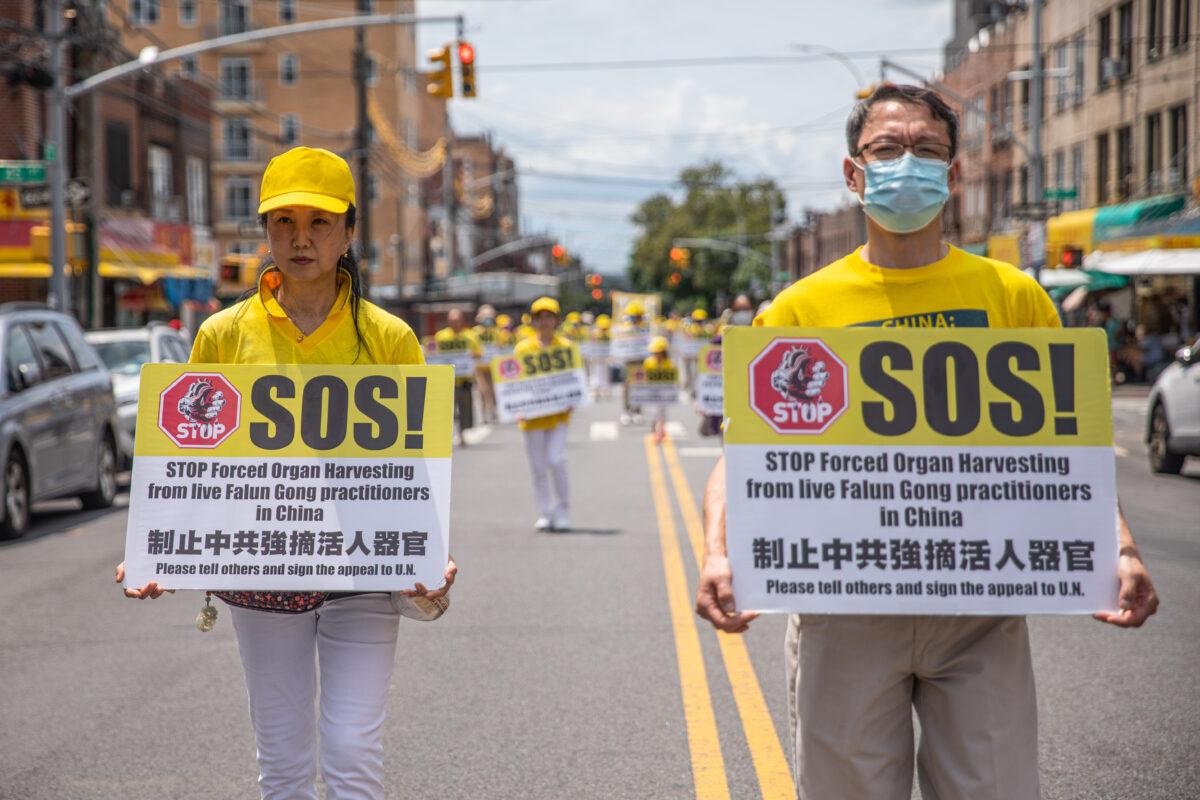Falun Gong practitioners take part in a parade marking the 22nd year of the persecution of Falun Gong in China, in Brooklyn on July 18, 2021. (Chung I Ho/The Epoch Times)
