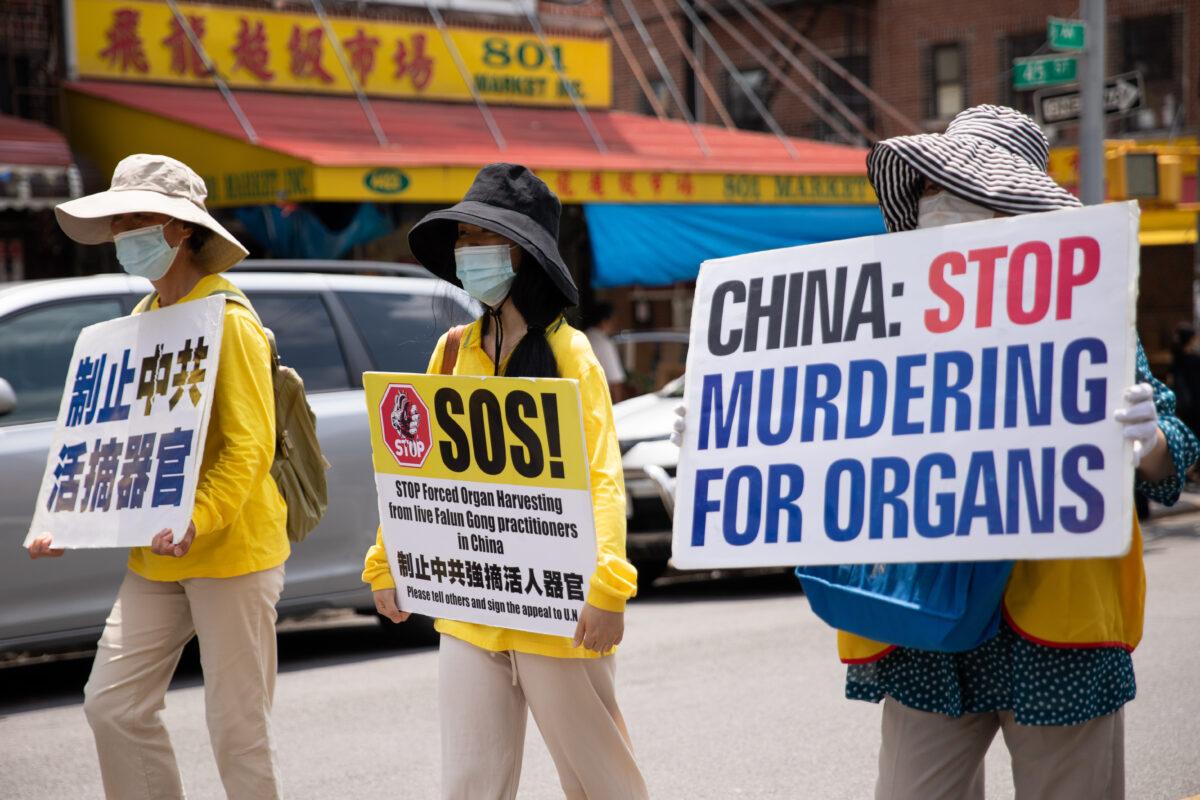 Falun Gong practitioners take part in a parade marking the 22nd year of the persecution of Falun Gong in China, in Brooklyn, N.Y., on July 18, 2021. (Chung I Ho/The Epoch Times)