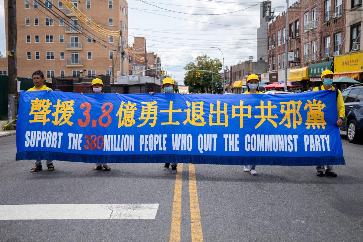 Falun Gong practitioners take part in a parade marking the 22nd year of the persecution of Falun Gong in China, in Brooklyn, N.Y., on July 18, 2021. (Chung I Ho/The Epoch Times)