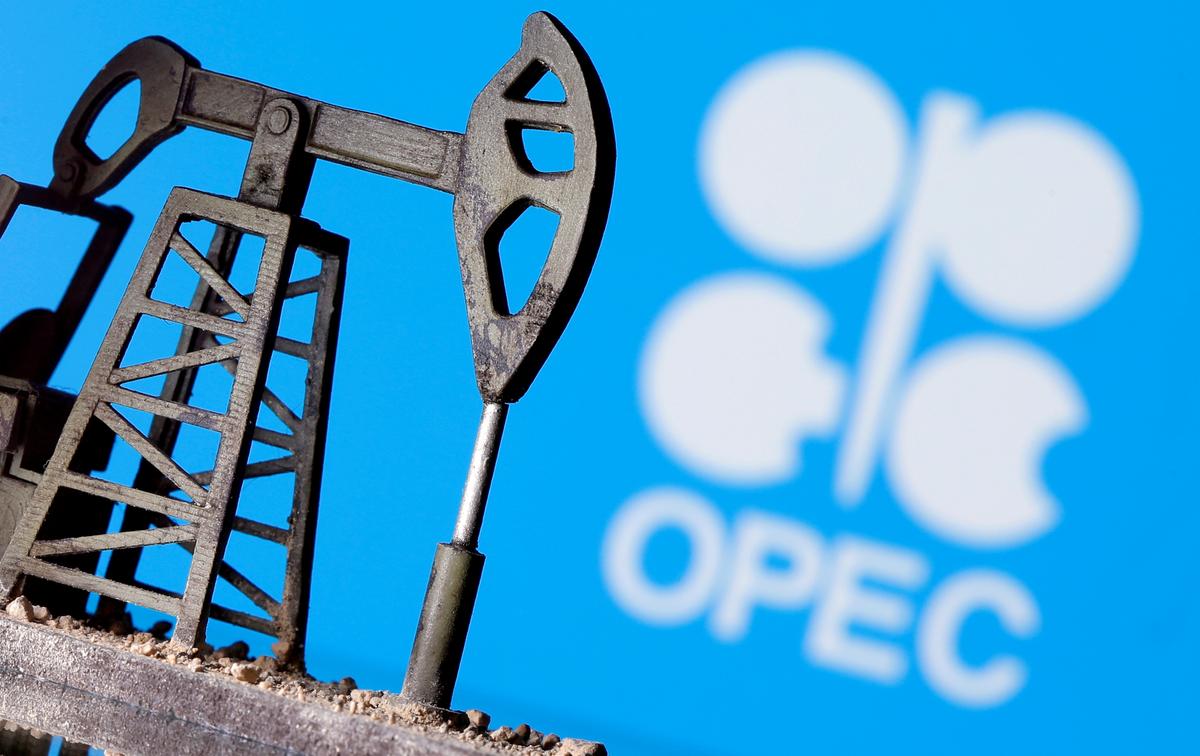 A 3D printed oil pump jack is seen in front of the OPEC logo in this illustration picture on April 14, 2020. (Dado Ruvic/Illustration/Reuters)