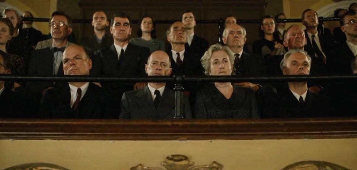 Audience at a piano concerto, with Nikita Khrushchev (Steve Buscemi, C), in "The Death of Stalin." (Entertainment One Films)
