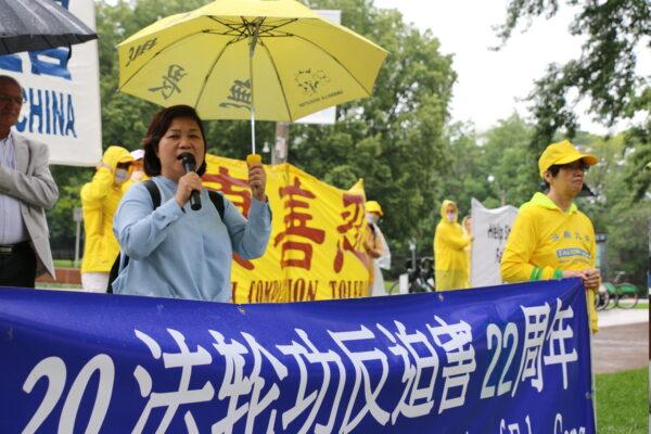 Gloria Fung, president of Canada-Hong Kong Link, speaks at the rally in downtown Toronto on July 17, 2021, voicing support for Falun Gong practitioners. (Andrew Chen/The Epoch Times)