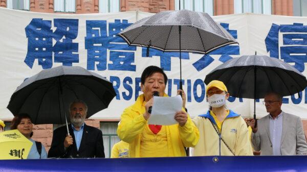 Shenli Lin, a Falun Gong adherent who was rescued to Canada in February 2002, speaks at the rally in Queen's Park, Toronto, on July 17, 2021.  (Andrew Chen/The Epoch Times)