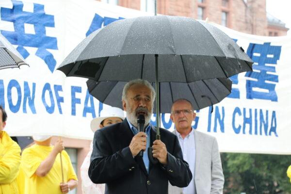 Former Senator Consiglio Di Nino speaks speaks at the rally in Queen's Park, Toronto, on July 17, 2021. (Andrew Chen/The Epoch Times)