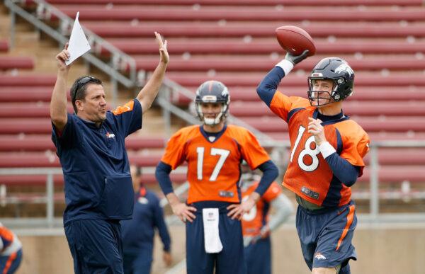 The quarterback coach Greg Knapp works with Brock Osweiler #17 and Peyton Manning #18 of the Denver Broncos during the Broncos practice for Super Bowl 50 at Stanford University in Stanford, Calif., on Feb. 3, 2016. (Ezra Shaw/Getty Images)
