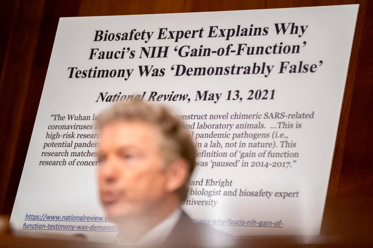 A sign is displayed behind Sen. Rand Paul (R-Ky.) as he speaks at a Senate Health, Education, Labor, and Pensions Committee hearing at the Dirksen Senate Office Building in Washington on July 20, 2021. (Stefani Reynolds/Pool/Getty Images)