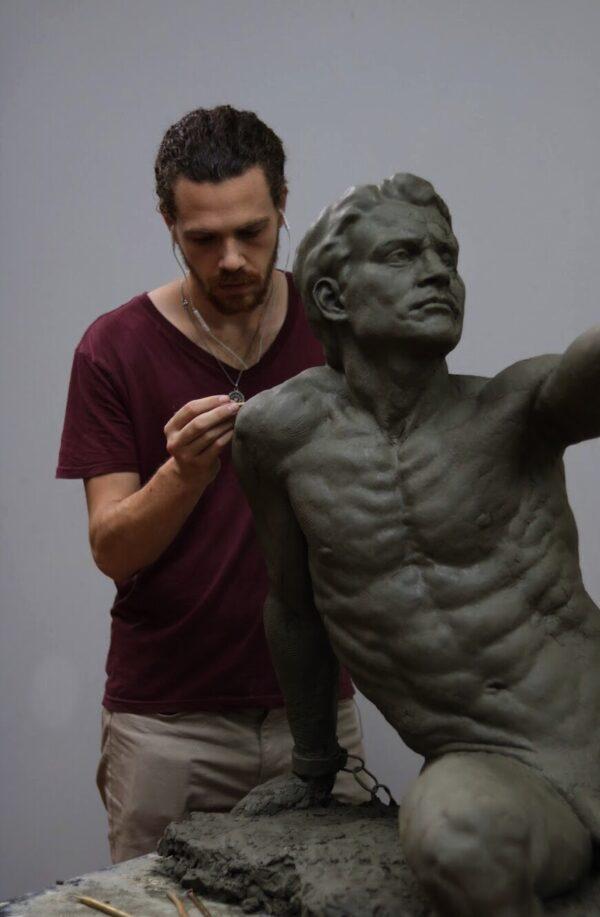 Sculptor Justin Ryan Kendall creating his award-winning sculpture "Prometheus" in clay. Kendall won two awards for the finished sculpture at the 14th International ARC Salon Competition (2019–2020): first place in the Fully From Life category and an honorable mention in the sculpture category. (Courtesy of Justin Ryan Kendall)
