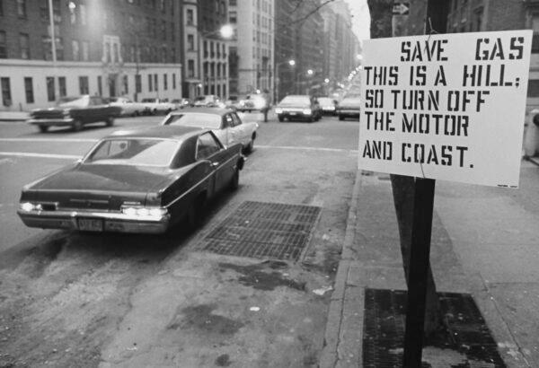 A sign by a road urging drivers to save fuel during the oil crisis of 1974 in the USA. (Archive Photos/Getty Images)
