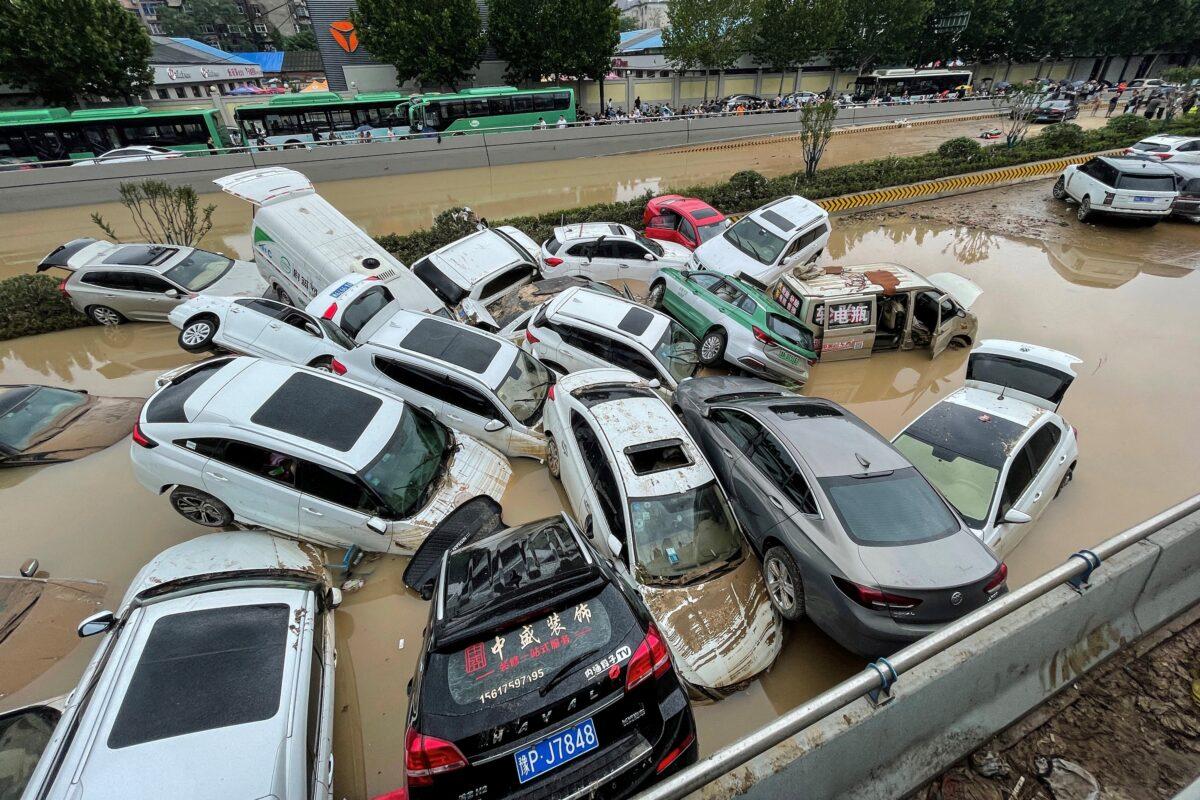 Cars sit in floodwaters after heavy rains hit the city of Zhengzhou, China, on July 21, 2021. (STR/AFP via Getty Images)