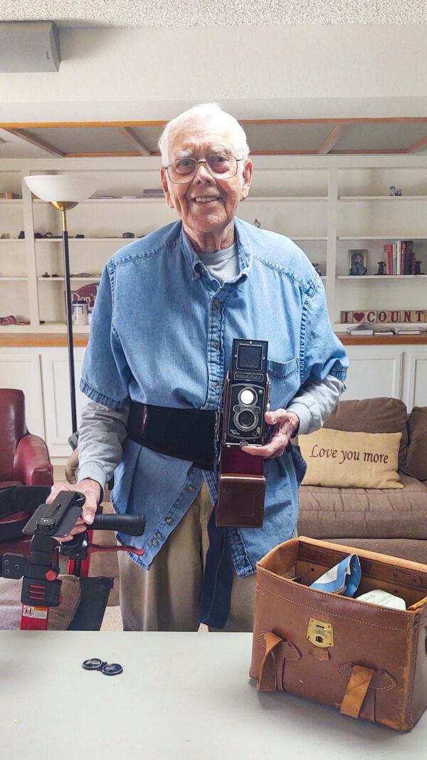  Arthur Moss poses with the beloved Rolleiflex camera he purchased in Japan in 1952 at his home in Apple Valley, Calif., on April 18, 2021. (Courtesy Arthur Moss)