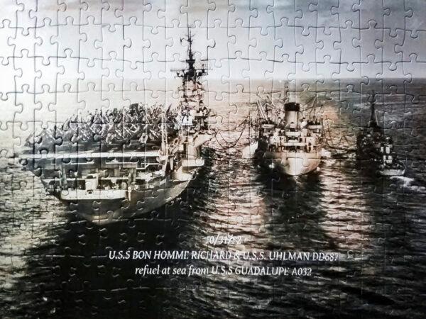 A 200-piece puzzle reproduction of a photo taken of the USS Bon Homme Richard and USS Uhlman DD687 refueling from USS Guadalupe at sea on Oct. 31, 1952. (Photo courtesy of Arthur Moss)