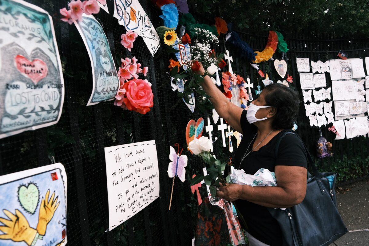 Memorials hang from the front gate of Greenwood Cemetery during an event and procession organized by Naming the Lost Memorials to remember and celebrate the lives of those killed by the COVID-19 pandemic in New York, on June 8, 2021. (Spencer Platt/Getty Images)
