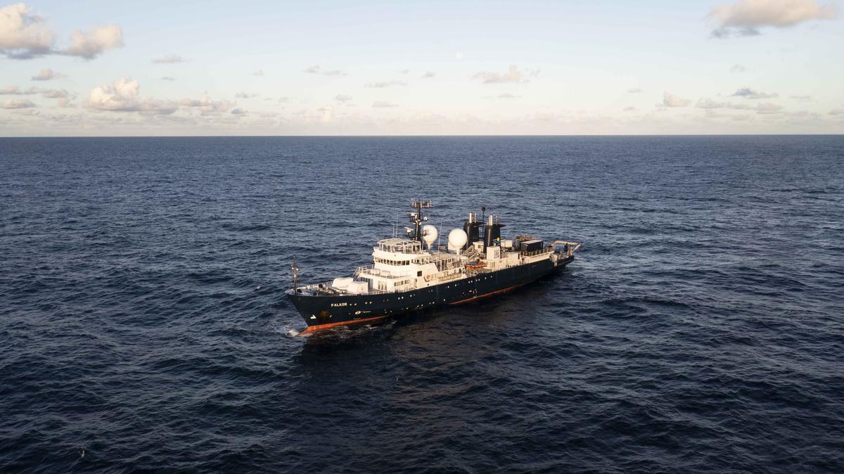 An aerial image of research vessel Falkor in U.S. Exclusive Economic Zone (EEZ) waters while working on unexplored and unnamed seamounts in the Phoenix Islands Archipelago. (Courtesy of <a href="https://schmidtocean.org/scientists-explore-seamounts-in-phoenix-islands-archipelago-gaining-new-insights-into-deep-water-diversity-and-ecology/">Schmidt Ocean Institute</a>)