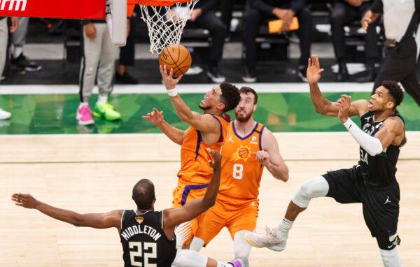 Phoenix Suns guard Devin Booker (1) shoots during the third quarter against the Milwaukee Bucks during game six of the 2021 NBA Finals at Fiserv Forum on Jul 20, 2021. (Jeff Hanisch-USA TODAY Sports)