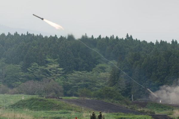 A Japan Ground Self-Defense Force (JGSDF) Type 92 mine-clearance vehicle launches a rocket during a live fire exercise at JGSDF's training grounds in the East Fuji Maneuver Area in Gotemba, Shizuoka, Japan on May 22, 2021. (Akio Kon - Pool/Getty Images)