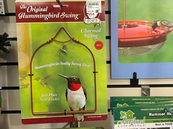 Hummingbirds use hummingbird swings such as the one pictured here that’s sold at Wild Birds Unlimited in Springfield, Illinois. Hummingbirds wait and watch from the swings over their feeders. (Tamara Browning)