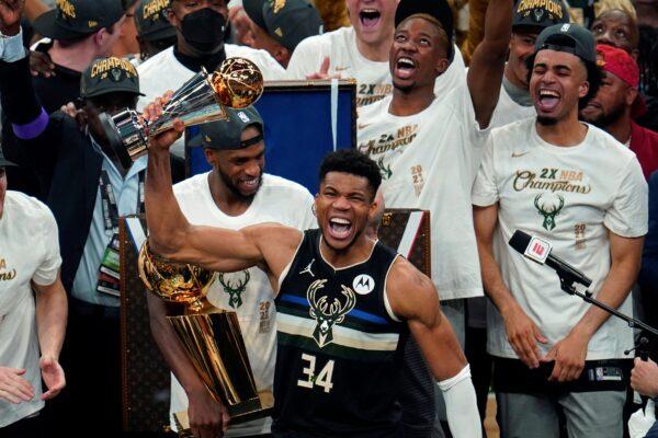 Milwaukee Bucks forward Giannis Antetokounmpo (34) holds the finals MVP trophy after the Bucks defeated the Phoenix Suns in Game 6 of basketball's NBA Finals in Milwaukee, Wis., on July 20, 2021. (Paul Sancya/AP Photo)