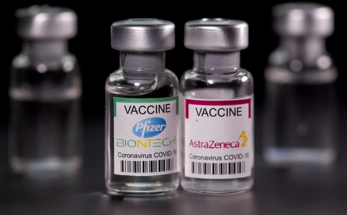 Vials with Pfizer-BioNTech and AstraZeneca COVID-19 vaccine labels are seen in this illustration picture taken March 19, 2021. (Dado Ruvic/Illustration/Reuters)