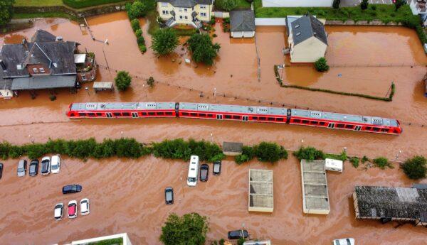 A regional train sits in the flood waters at the local station after it was flooded by the high waters of the Kyll river in Kordel, Germany, on July 15, 2021. (Sebastian Schmitt/dpa via AP)