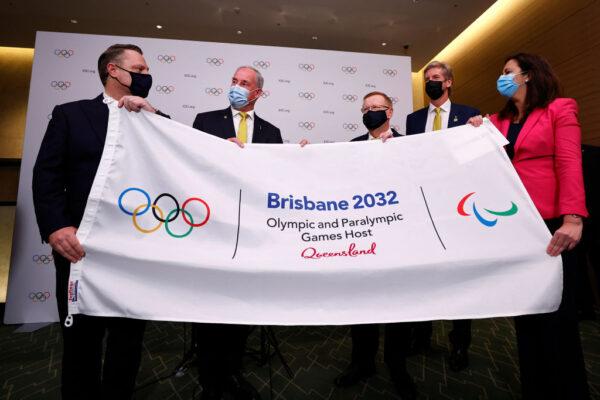 (L-R) Councillor Adrian Schrinner, Lord Mayor of Brisbane; Senator Richard Colbeck, Minister for Senior Australians, Aged Care Services, and Sport; John Coates AC, President, Australian Olympic Committee; James Tomkins, three time Olympic gold medalist; and Annastacia Palaszczuk MP, Premier of Queensland and Minister for Trade, attend a press conference after Brisbane was announced as the 2032 Summer Olympics host city during the 138th IOC Session at Hotel Okura in Tokyo, Japan, on July 21, 2021. (Toru Hanai/Getty Images)