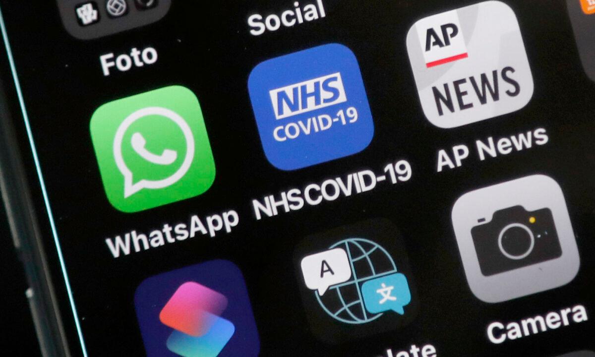 Photo of an iphone showing the NHS COVID-19 mobile phone contact tracing application on Sept. 24, 2020. (Frank Augstein/AP Photo)