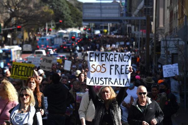 Australian protestors march during the ‘World Wide Rally For Freedom’ anti-lockdown rally in Sydney, Australia on July 24, 2021. (AAP Image/Mick Tsikas)