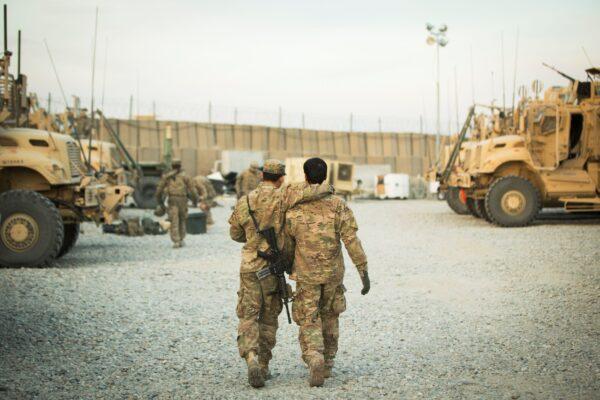 A U.S. soldier from the 3rd Cavalry Regiment walks with the unit's Afghan interpreter before a mission near forward operating base Gamberi in the Laghman province of Afghanistan on Dec. 11, 2014. (Lucas Jackson/File Photo/Reuters)