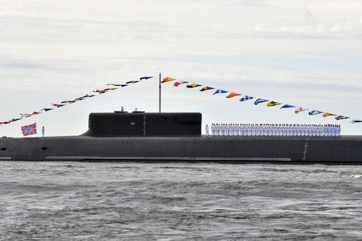 Sailors line up on a deck of the nuclear-powered ballistic missile submarine K-549 Knyaz Vladimir before the Navy Day parade in Saint Petersburg, Russia, on July 25, 2021. (Sputnik/Aleksey Nikolskyi/Kremlin via Reuters)