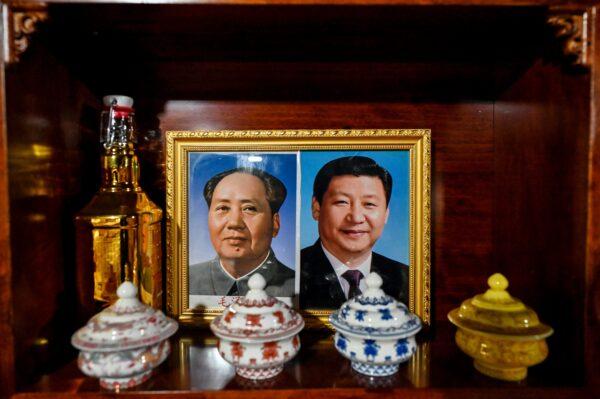 A government-organized media tour shows an image of Chinese leader Xi Jinping (R) and late communist leader Mao Zedong at a hotel in the village of Tashigang, Nyingtri, Tibet, on June 4, 2021. (Hector Retamal/AFP via Getty Images)