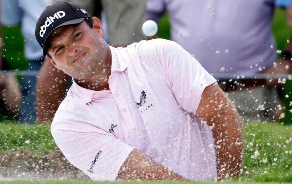 Patrick Reed plays a shot from a bunker on the fifth hole during the first round of the Charles Schwab Challenge golf tournament at the Colonial Country Club in Fort Worth, Texas, on May 27, 2021. (Ron Jenkins/AP)