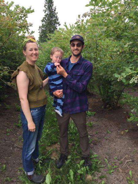 Siblings Audrey Matheson and Ezra Ranz, with Ezra's son Soren, standing in old-growth Rubel blueberry bushes. (Eric Lucas)