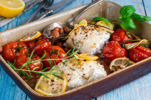 Halibut baked in white wine with borlotti beans and tomatoes. (BBA Photography/Shutterstock)