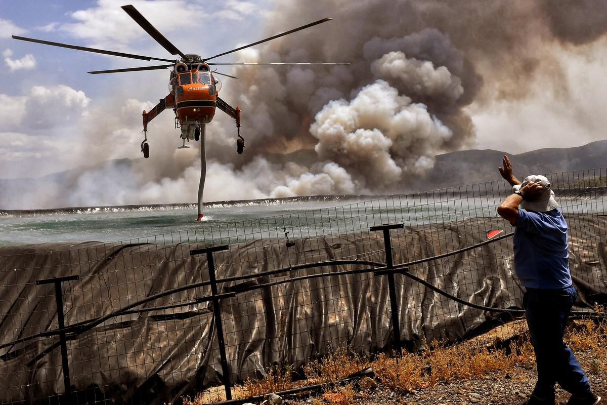 Southern Europe Battles Wildfires as North Cleans up After Floods